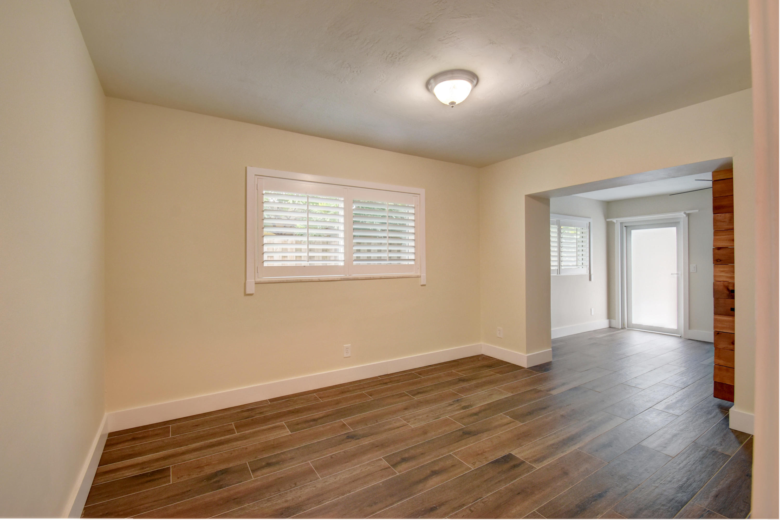1266 Southwest 5th Street Boca Raton, FL 33486 - Photo 22 of 30 a view of an empty room with wooden floor and a window
