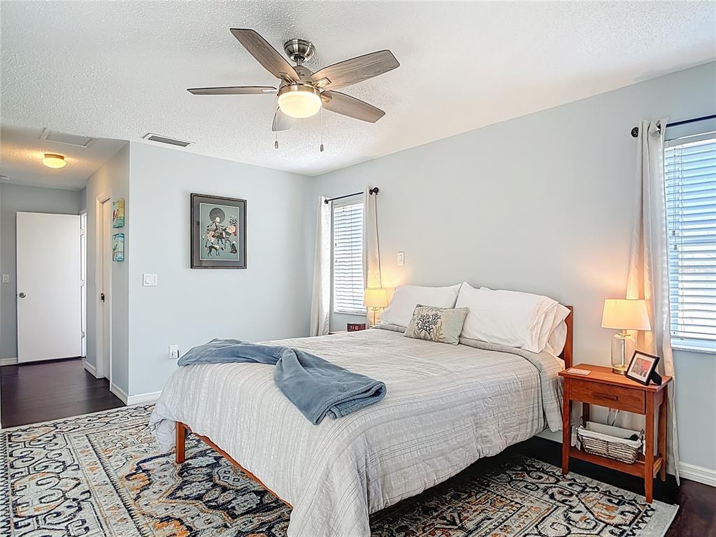 10253 Winstead Avenue Englewood, FL 34224 - Photo 11 of 46 a bedroom with a bed a window and a dresser