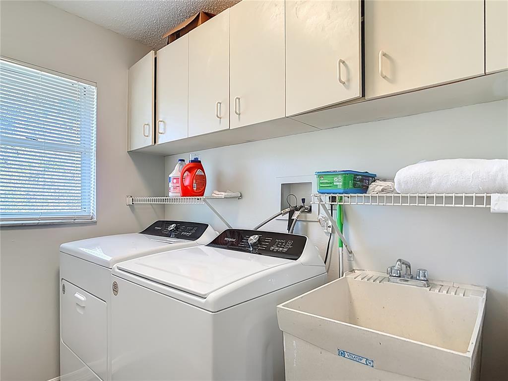 10253 Winstead Avenue Englewood, FL 34224 - Photo 26 of 46 a utility room with dryer and washer