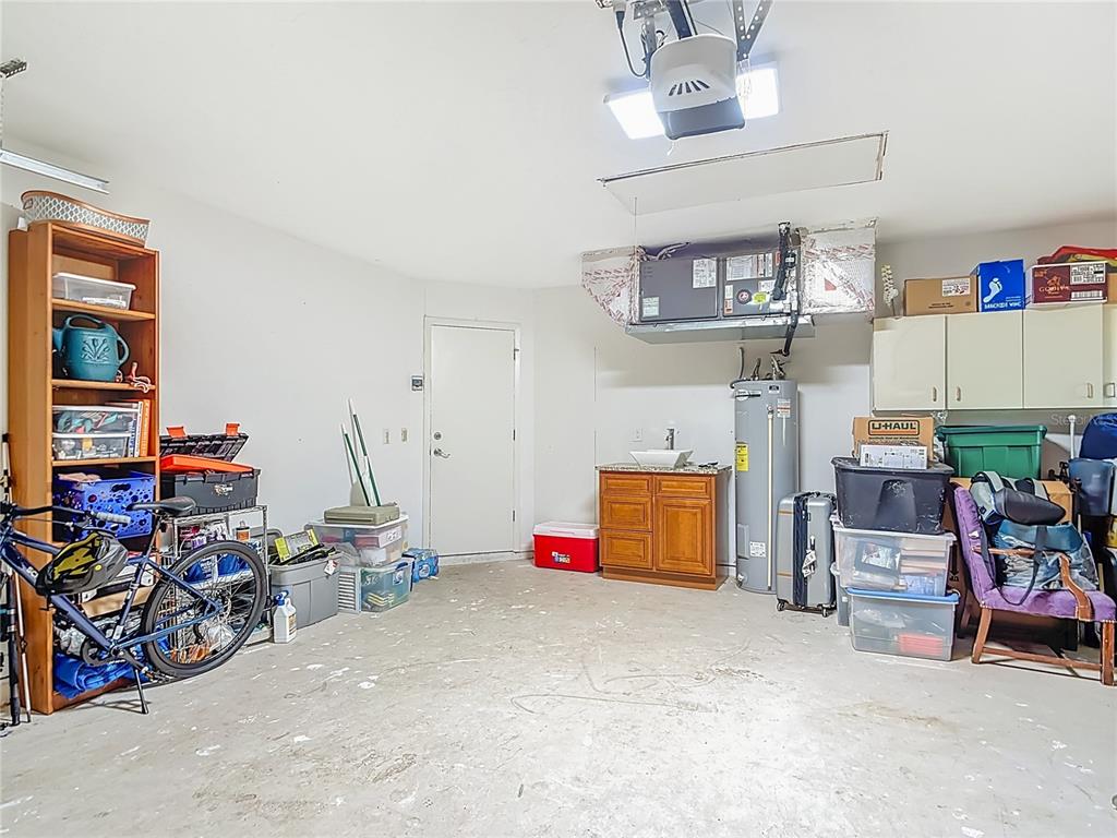 10253 Winstead Avenue Englewood, FL 34224 - Photo 27 of 46 a bedroom with furniture and a chandelier