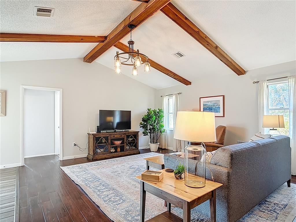10253 Winstead Avenue Englewood, FL 34224 - Photo 28 of 46 a living room with furniture and a flat screen tv
