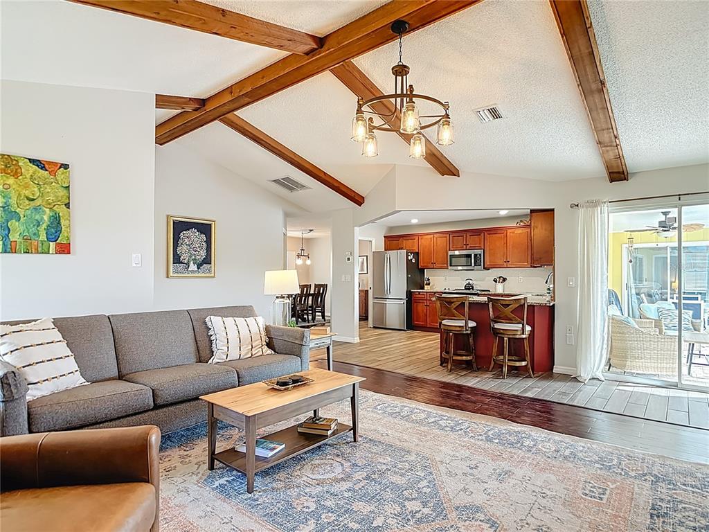 10253 Winstead Avenue Englewood, FL 34224 - Photo 29 of 46 a living room with furniture ceiling fan and a rug