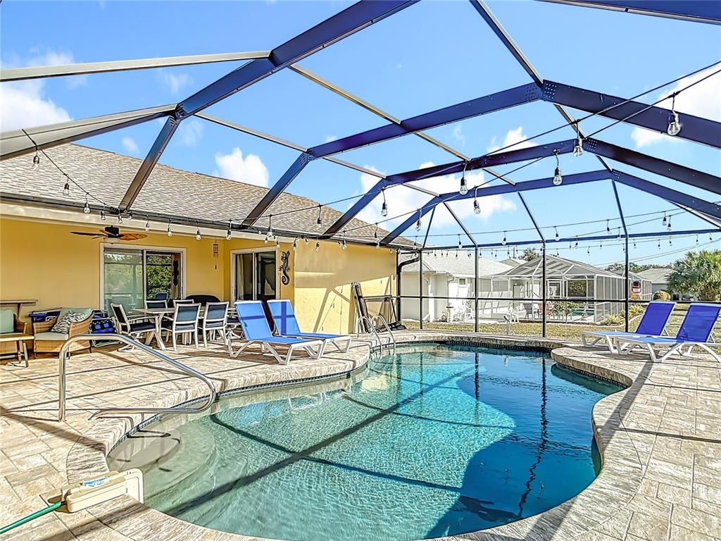 10253 Winstead Avenue Englewood, FL 34224 - Photo 34 of 46 a view of a swimming pool with a patio