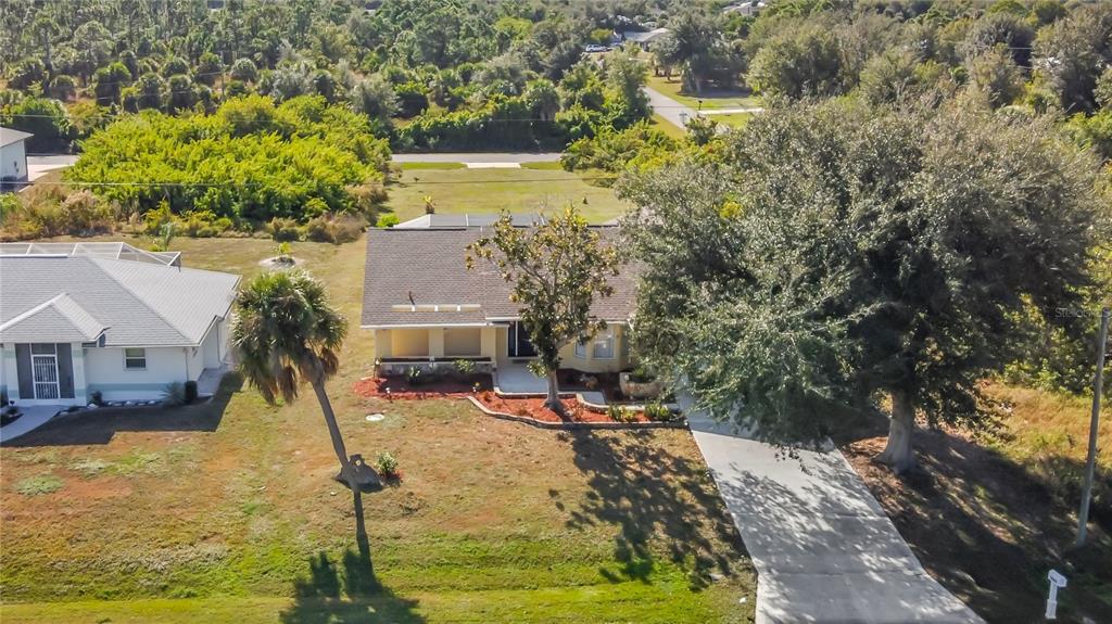 10253 Winstead Avenue Englewood, FL 34224 - Photo 38 of 46 a swimming pool with some trees in the background