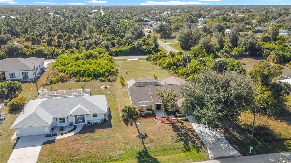 10253 Winstead Avenue Englewood, FL 34224 - Photo 46 of 46 an aerial view of residential houses with outdoor space