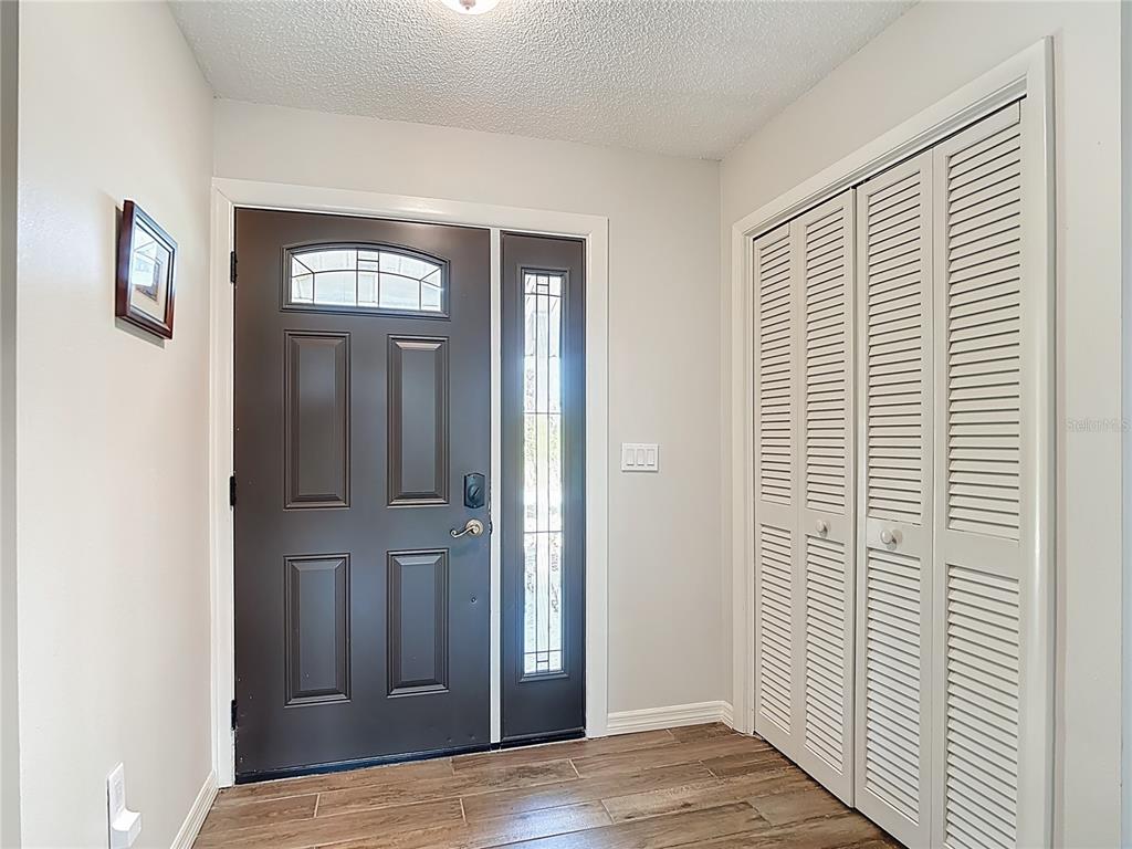 10253 Winstead Avenue Englewood, FL 34224 - Photo 5 of 46 a view of a livingroom with wooden floor and a window
