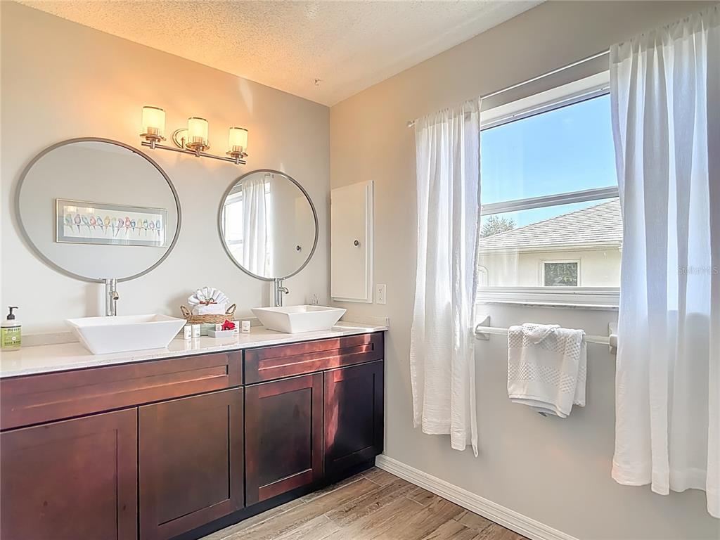 10253 Winstead Avenue Englewood, FL 34224 - Photo 8 of 46 a bathroom with a sink and a mirror