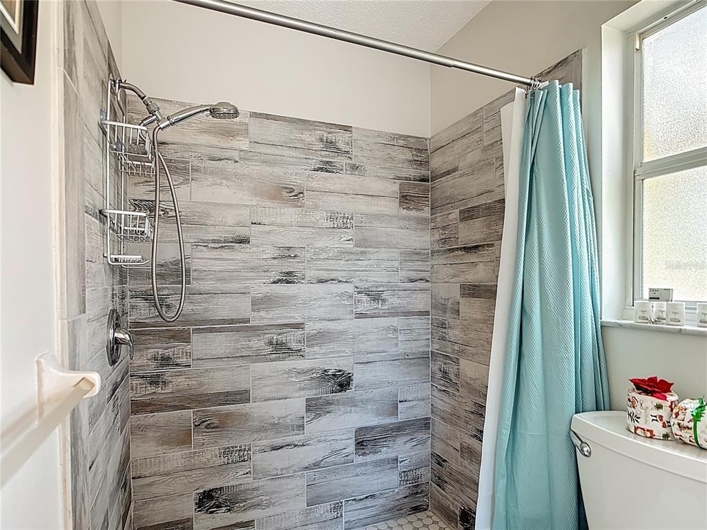 10253 Winstead Avenue Englewood, FL 34224 - Photo 9 of 46 a bathroom with a shower