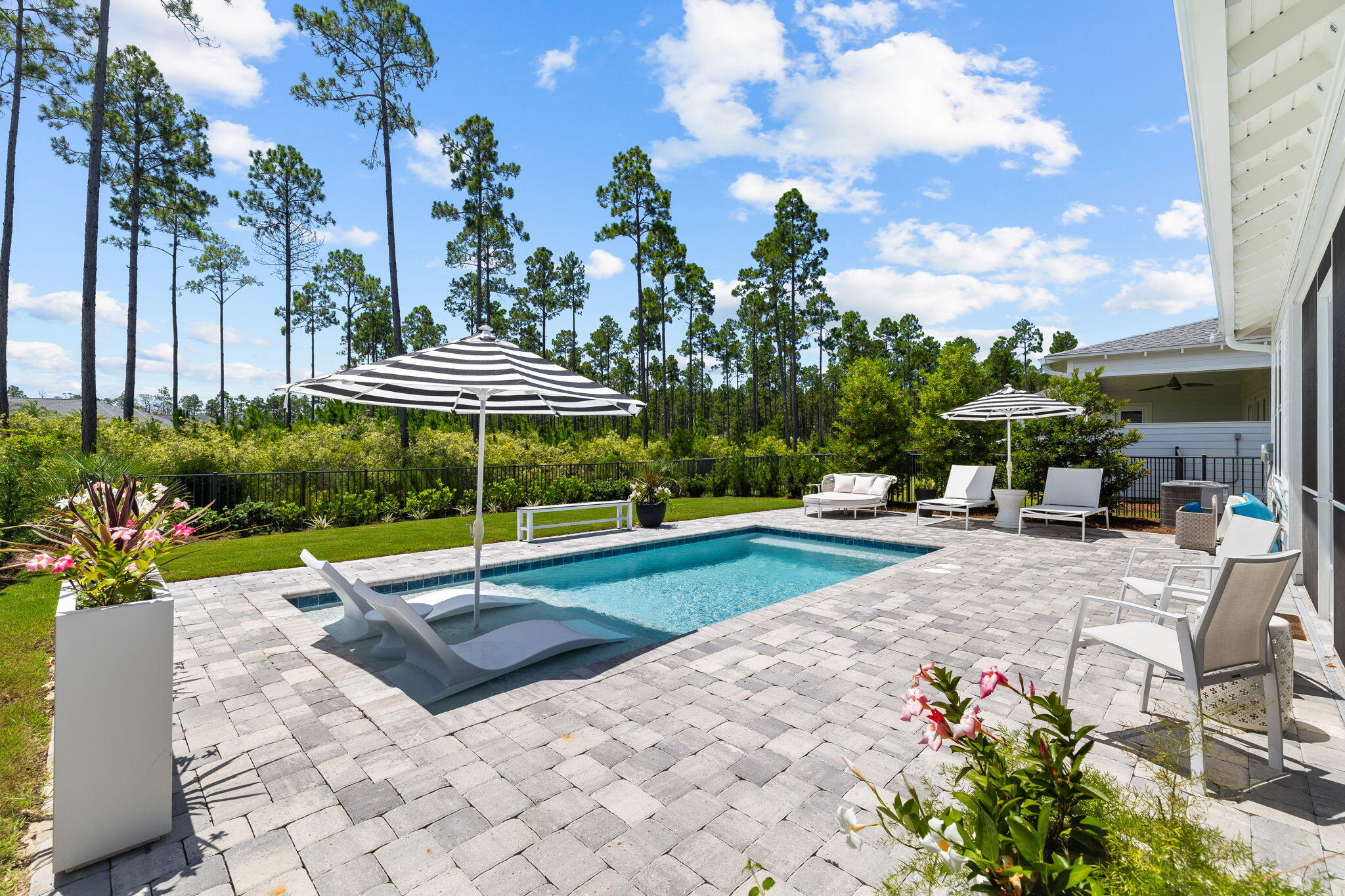 292 Naturewalk Blvd Inlet Beach Inlet Beach, FL 32461 - Photo 1 of 2 a view of a patio with a table and chairs