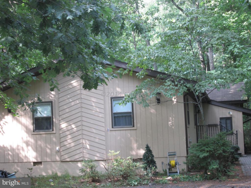 165 Windjammer Road Berlin, MD 21811 - Photo 2 of 26 a brick house with a tree in front of it