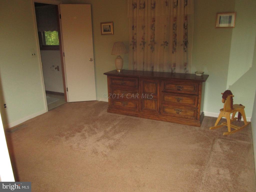 165 Windjammer Road Berlin, MD 21811 - Photo 20 of 26 a view of a closet with wooden floor