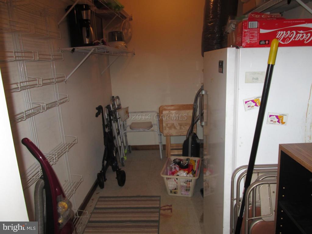 165 Windjammer Road Berlin, MD 21811 - Photo 21 of 26 a view of walk in closet with clothes and shoes