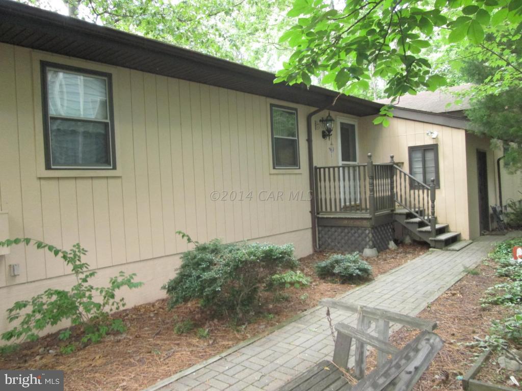 165 Windjammer Road Berlin, MD 21811 - Photo 4 of 26 a front view of a house with garden
