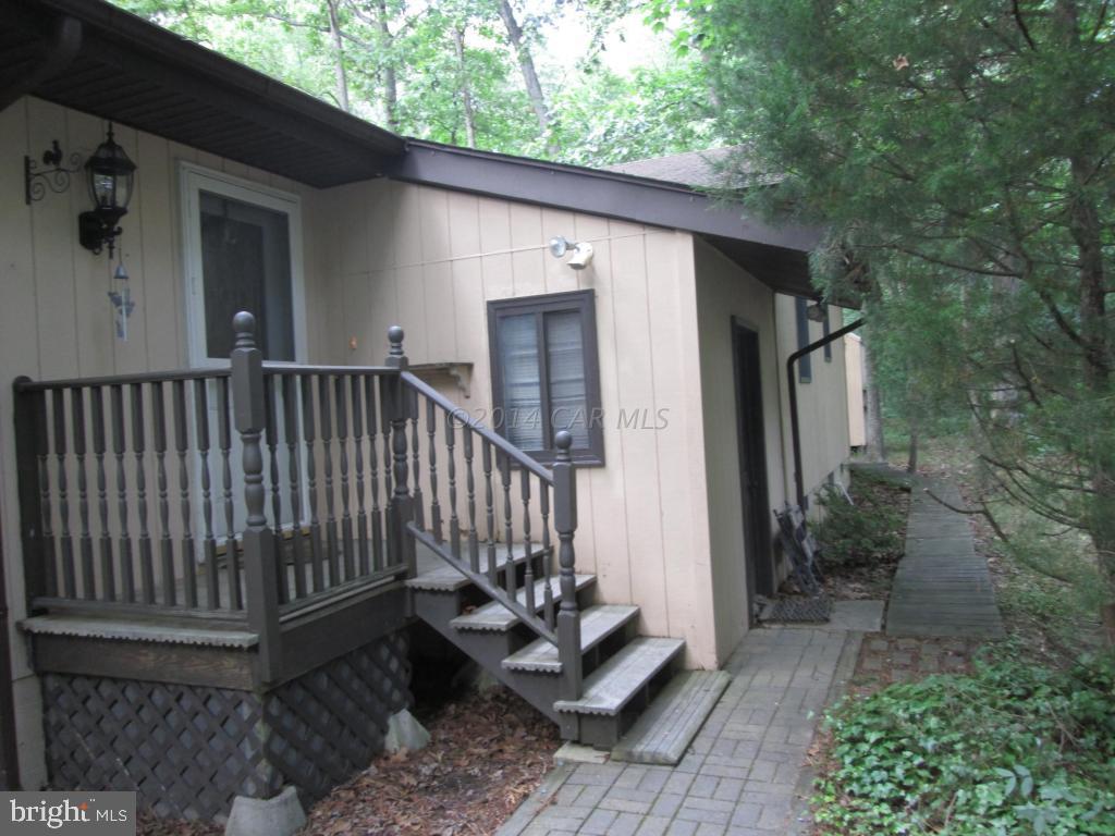 165 Windjammer Road Berlin, MD 21811 - Photo 5 of 26 a view of a wooden deck and a backyard