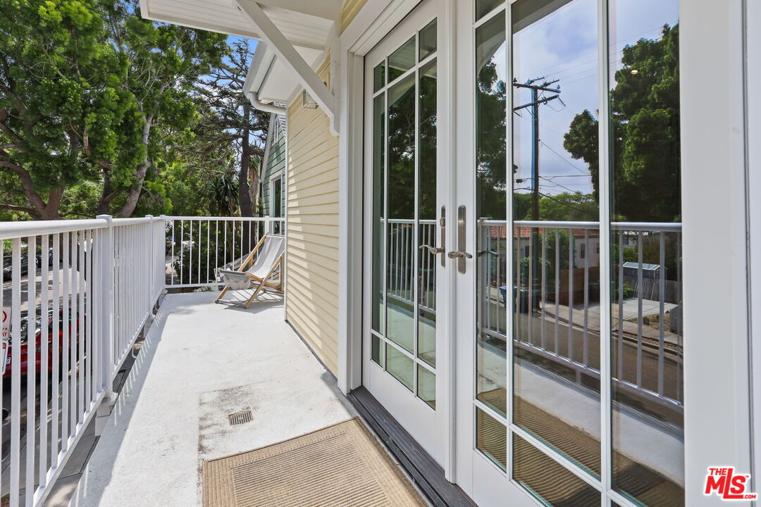 652 Kensington Road, Unit B Santa Monica, CA 90405 - Photo 2 of 15 a view of a balcony with wooden floor