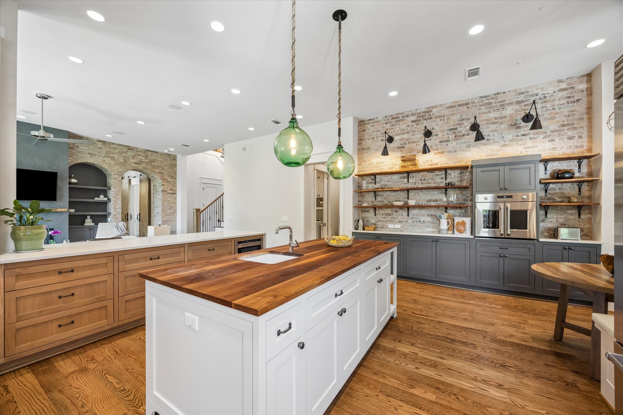 1101 Omar Street Houston, TX 77009 - Photo 15 of 46 A generous butcher block prep station with additional sink creates a true culinary workspace perfect for family cooking, entertaining, baking, and gathering together.