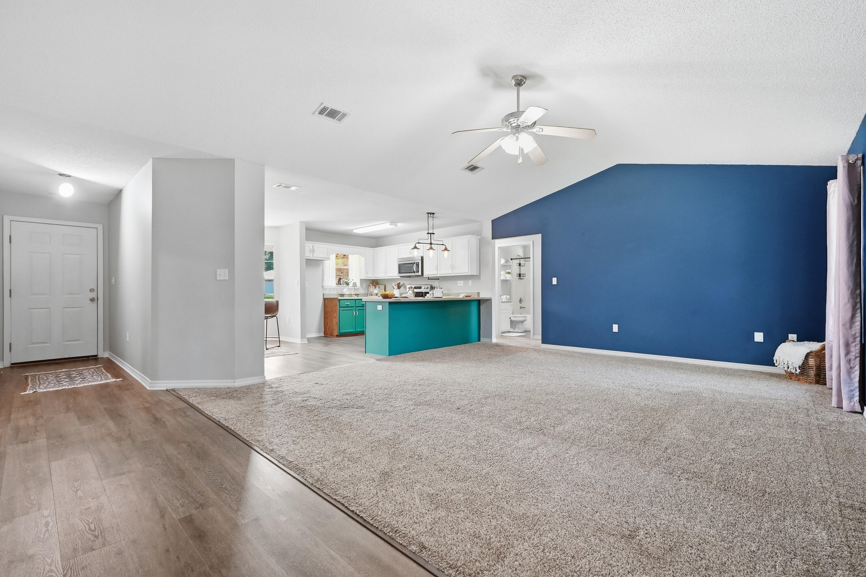 3033 Cabela Lane Crestview, FL 32539 - Photo 5 of 32 a view of a livingroom with a kitchen