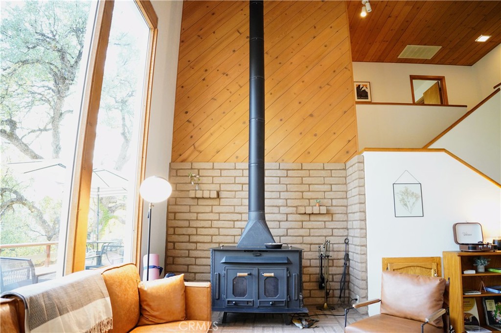 40659 Indian Springs Road Oakhurst, CA 93644 - Photo 2 of 28 a view of living room with furniture and large windows