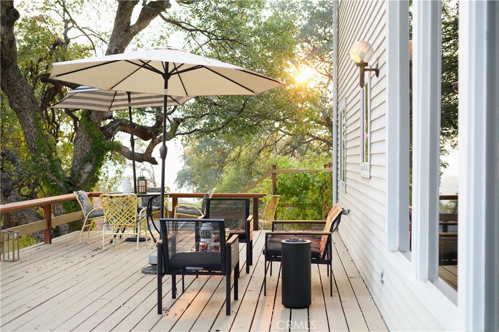 40659 Indian Springs Road Oakhurst, CA 93644 - Photo 27 of 28 a view of deck with furniture and barbeque oven with wooden floor and a barbeque