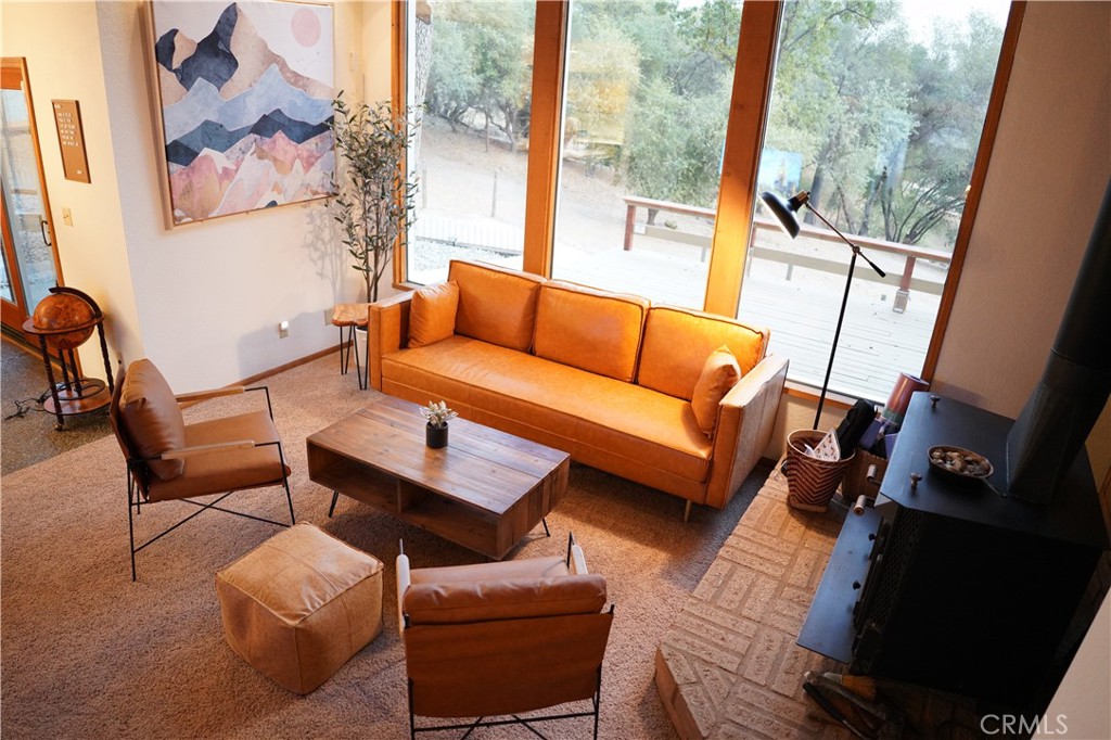 40659 Indian Springs Road Oakhurst, CA 93644 - Photo 4 of 28 a living room with furniture and a large window
