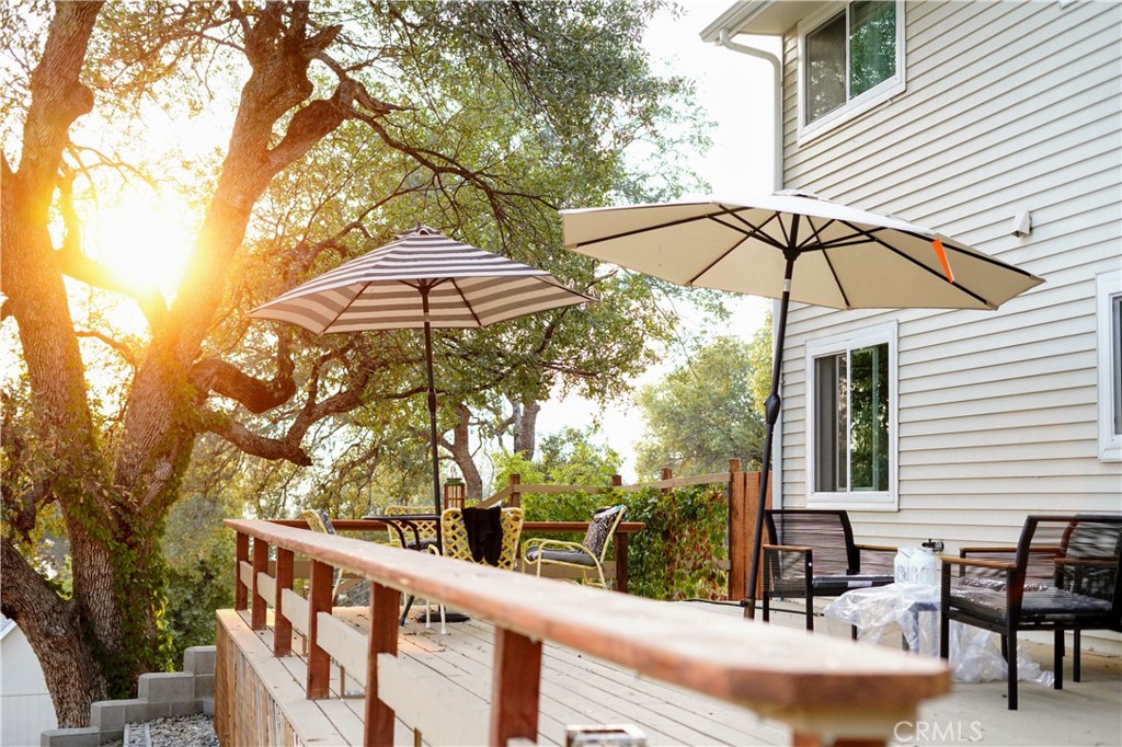 40659 Indian Springs Road Oakhurst, CA 93644 - Photo 5 of 28 a view of a chair and table in the balcony