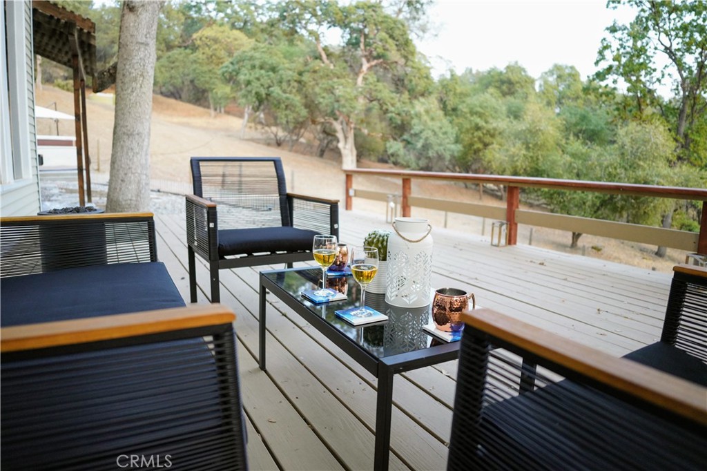 40659 Indian Springs Road Oakhurst, CA 93644 - Photo 9 of 28 a view of a deck with chairs