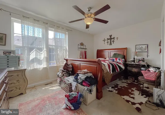 a bed room with a bed and a window