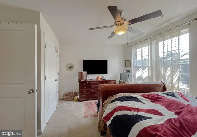a bedroom with a bed and flat screen tv