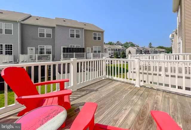 a view of a deck with a table and chairs