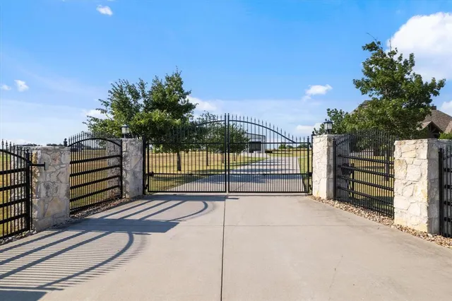 a front view of a house with swimming pool having outdoor seating