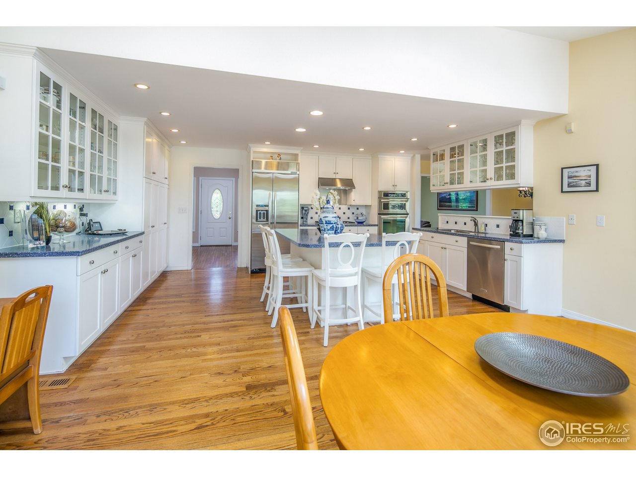 1715 View Point Road Boulder, CO 80305 - Photo 11 of 33 a dining hall with stainless steel appliances granite countertop a granite counter tops a dining table and chairs