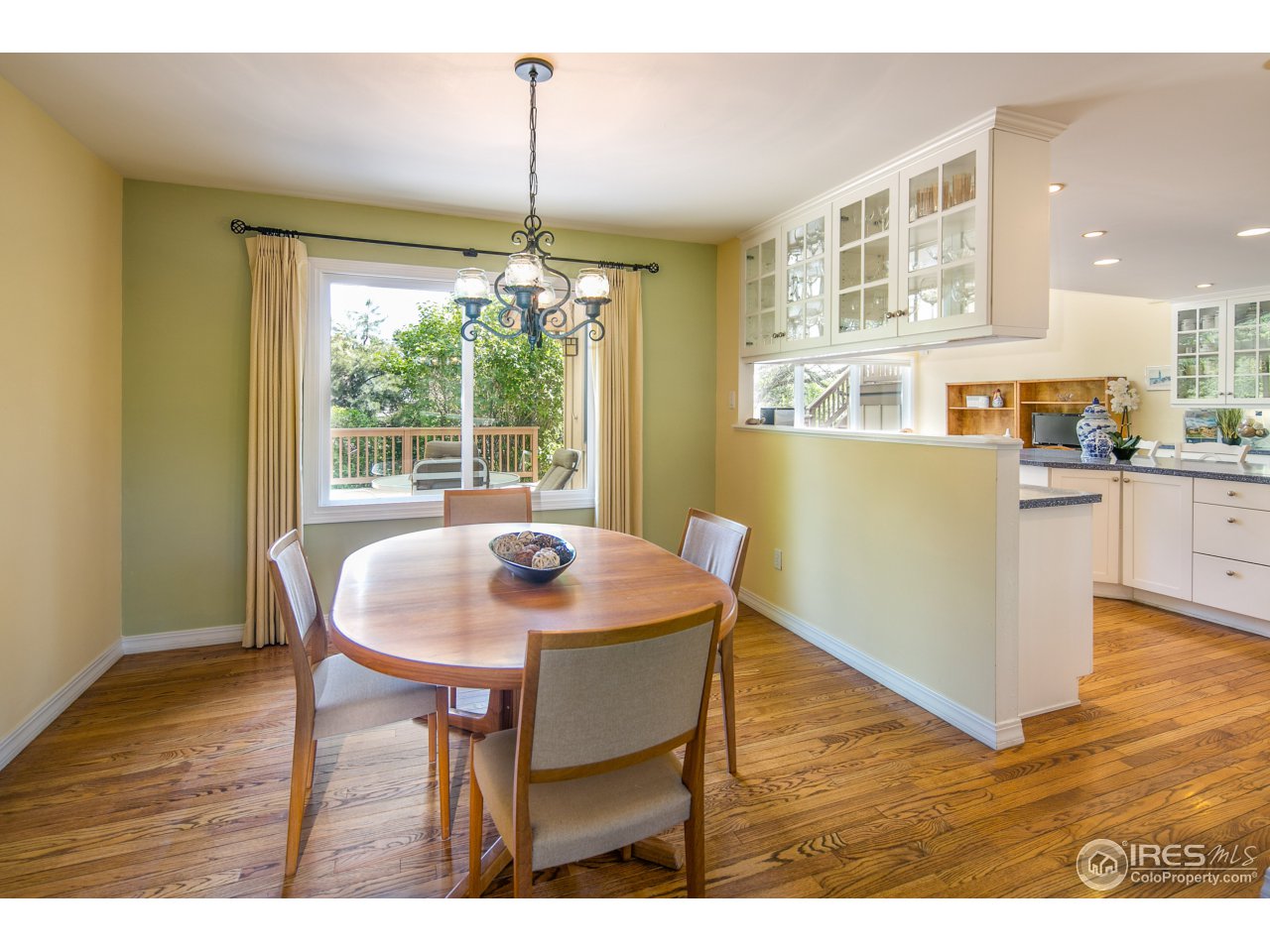 1715 View Point Road Boulder, CO 80305 - Photo 12 of 33 a dining room with furniture and wooden floor