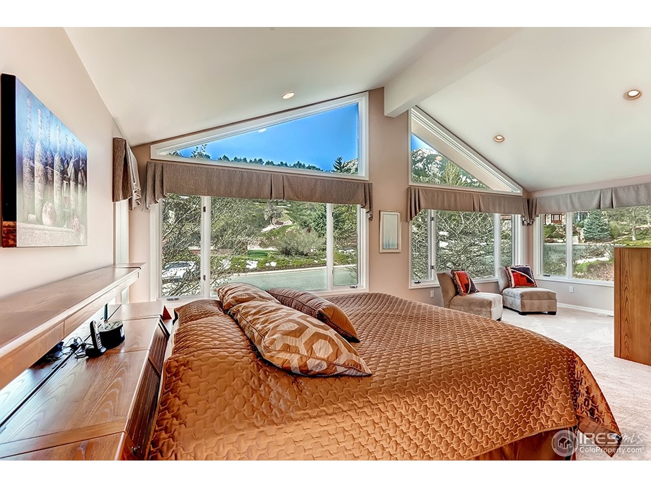 1715 View Point Road Boulder, CO 80305 - Photo 13 of 33 a bed sitting in a bedroom next to a large window