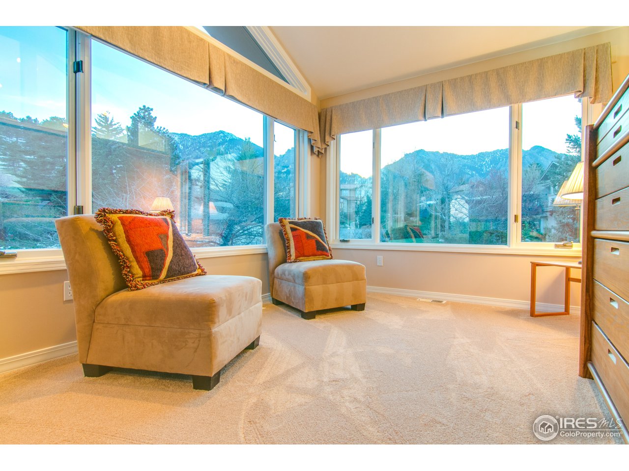 1715 View Point Road Boulder, CO 80305 - Photo 14 of 33 a bedroom with furniture and a large window