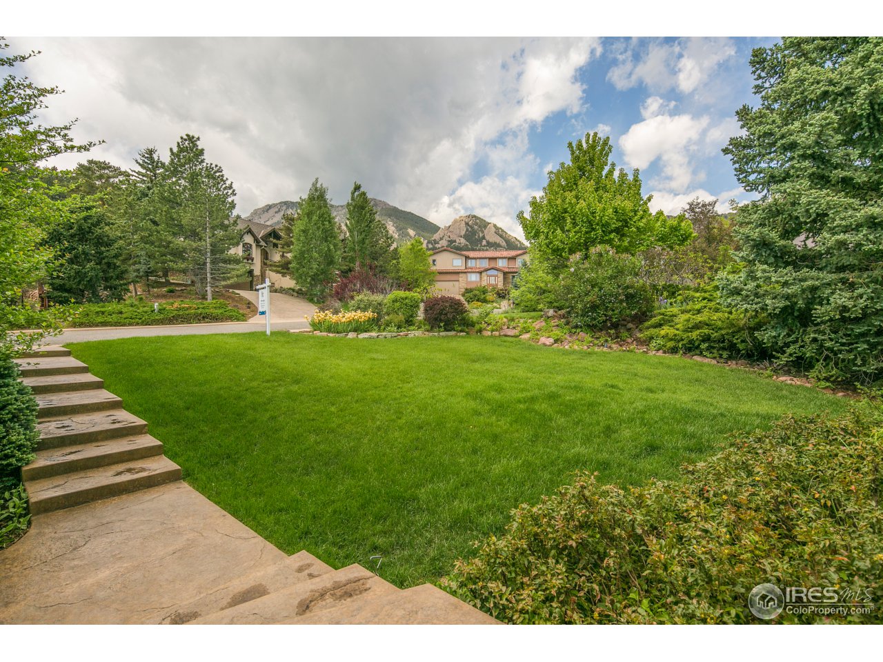 1715 View Point Road Boulder, CO 80305 - Photo 4 of 33 a backyard of a house with lots of green space