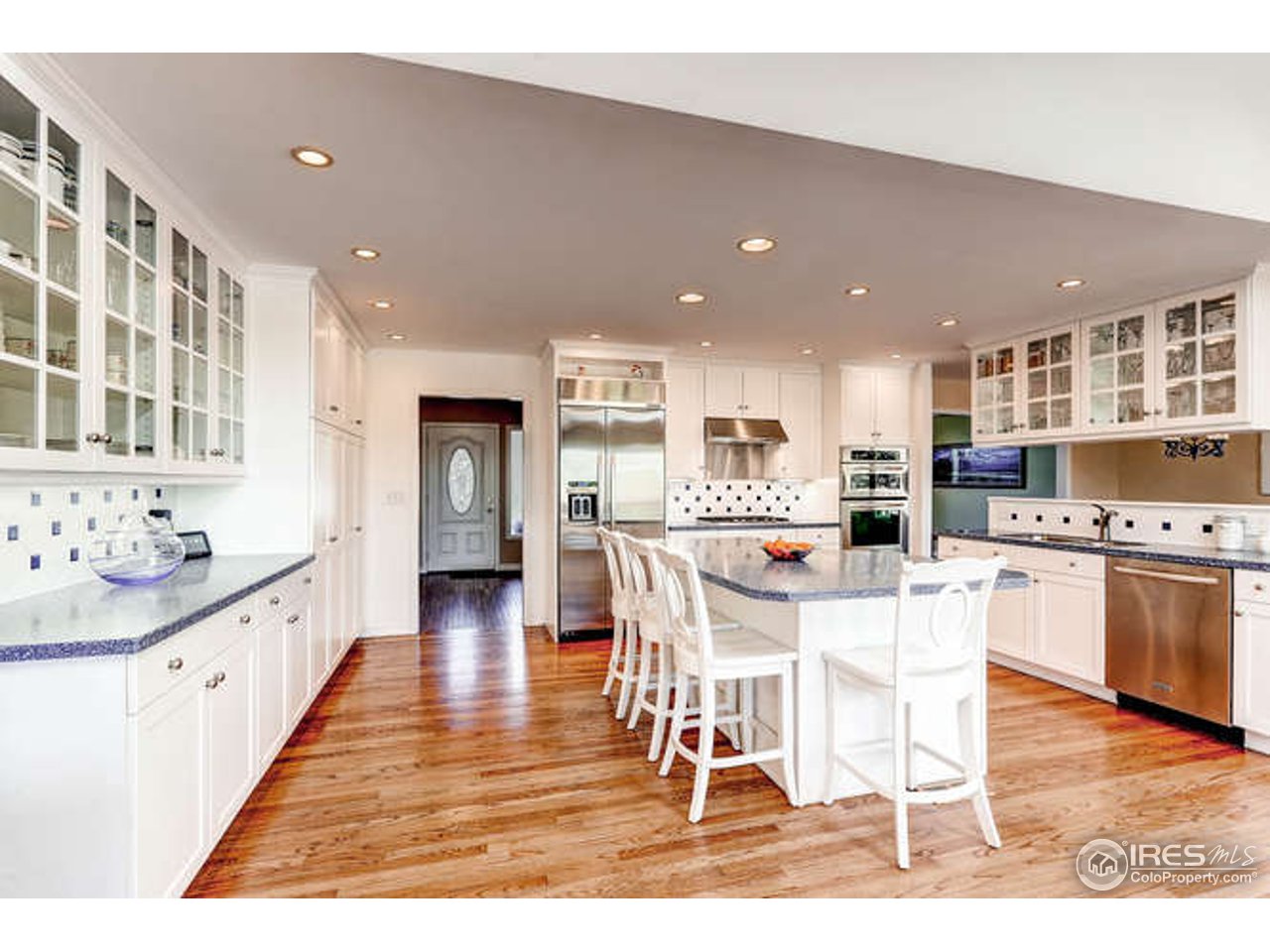 1715 View Point Road Boulder, CO 80305 - Photo 9 of 33 a kitchen with stainless steel appliances kitchen island granite countertop a sink and cabinets
