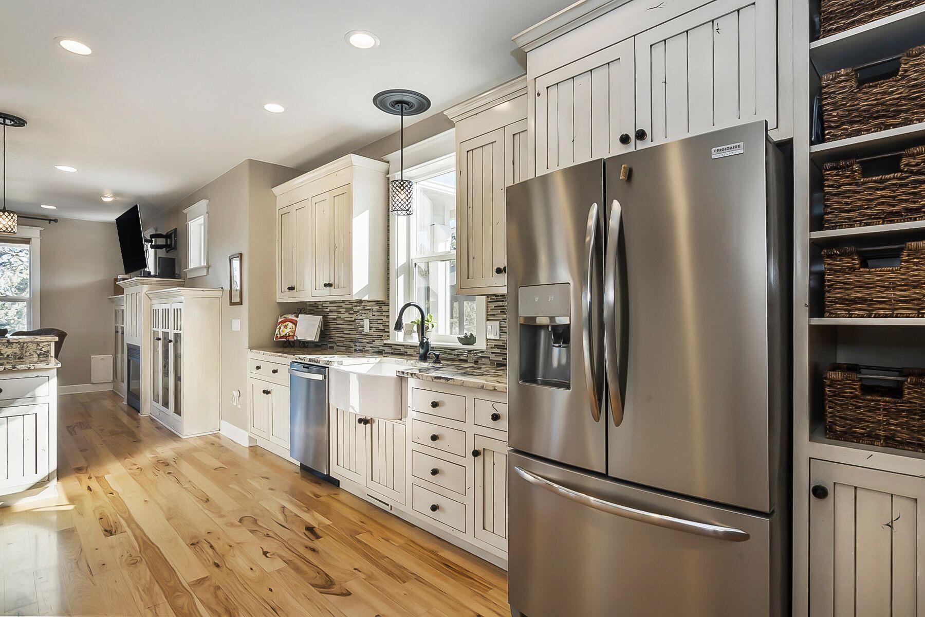 21530 Dale Road Bend, OR 97701 - Photo 10 of 46 a kitchen with stainless steel appliances a refrigerator sink and cabinets