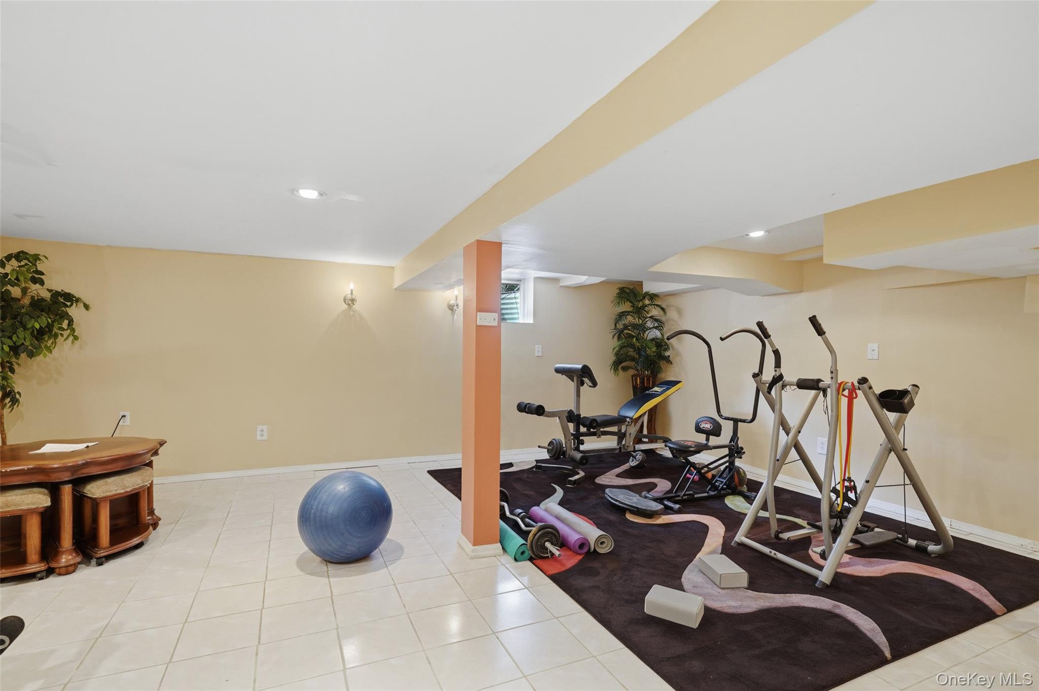 623 Cardinal Road Cortlandt Manor, NY 10567 - Photo 27 of 40 a room with gym equipment and air hockey table