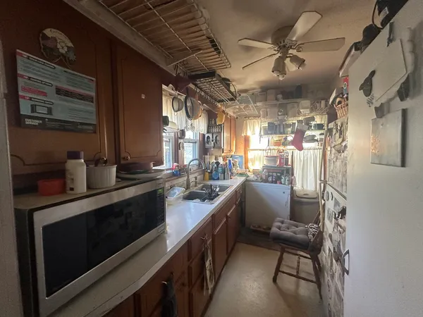 a kitchen with counter top space and stainless steel appliances