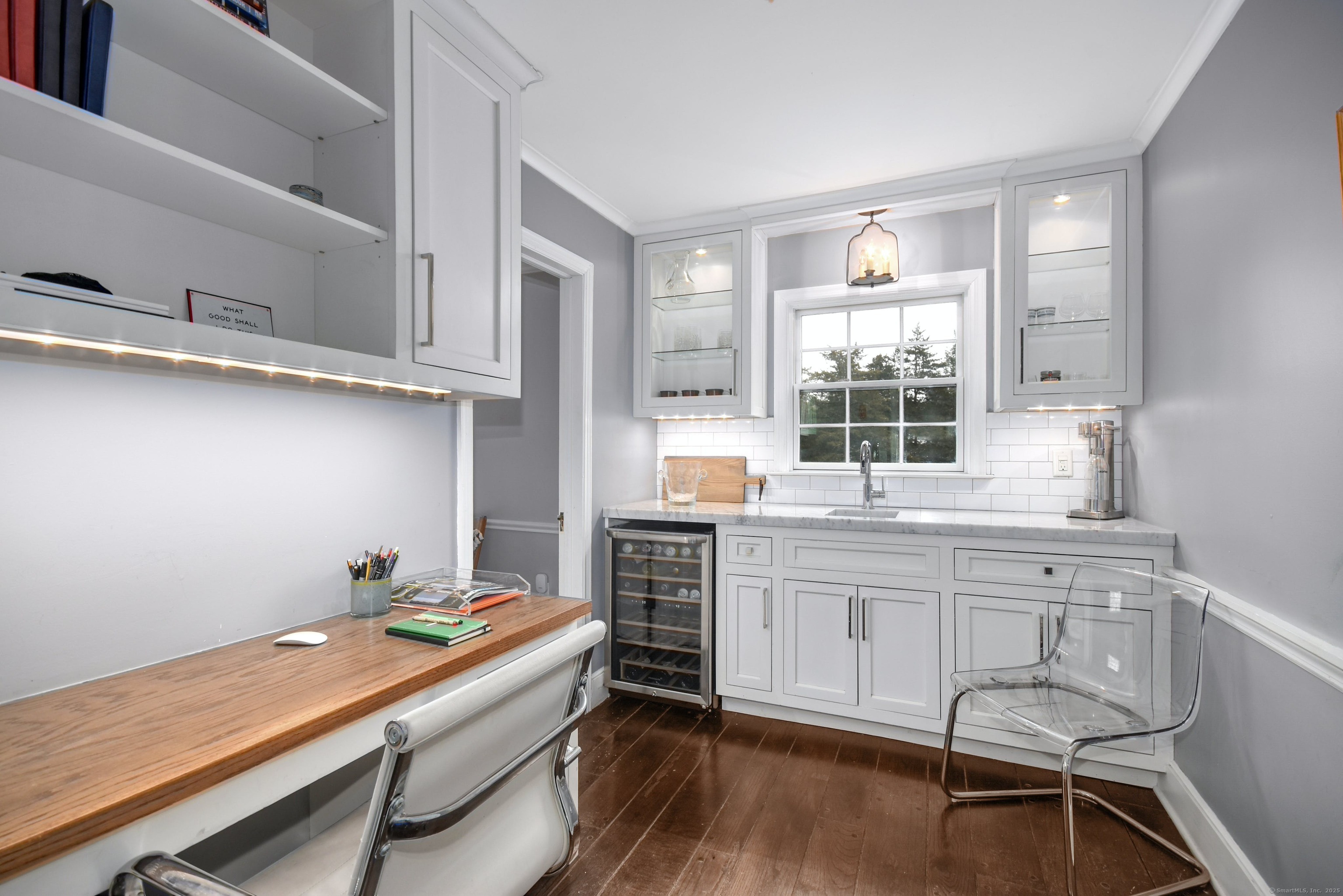 24 Cartbridge Road Weston, CT 06883 - Photo 15 of 27 The combination butler pantry/office with honed marble countertops, sink, wine cooler, and built in desk area is a fabulous addition.