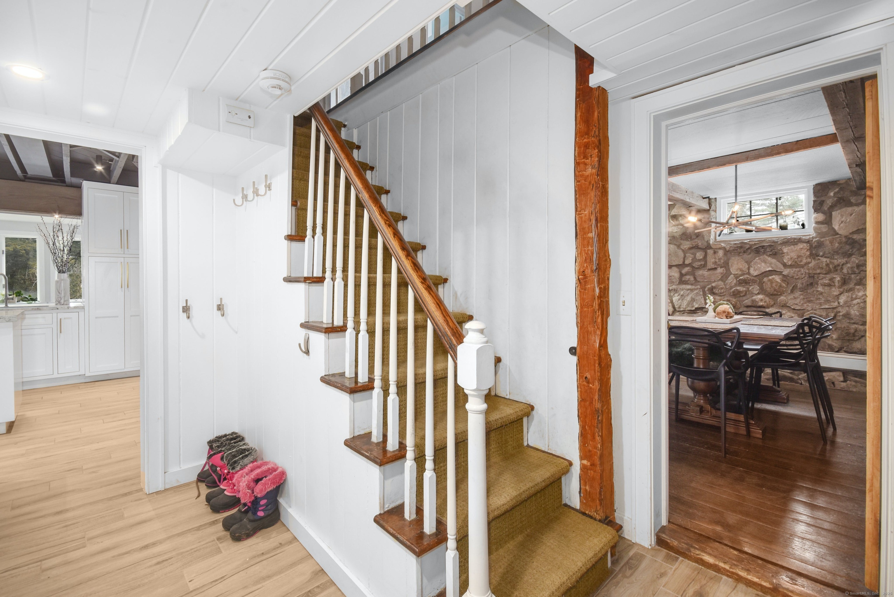 24 Cartbridge Road Weston, CT 06883 - Photo 5 of 27 The First Floor boasts a beautifully renovated kitchen, which opens into a light filled sun room as well as an inviting family room and dining room