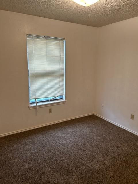 6111 38th Street, Unit B Lubbock, TX 79407 - Photo 7 of 9 an empty room with a window