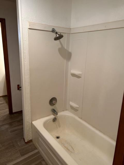 6111 38th Street, Unit B Lubbock, TX 79407 - Photo 9 of 9 a bathroom with a tub and a shower