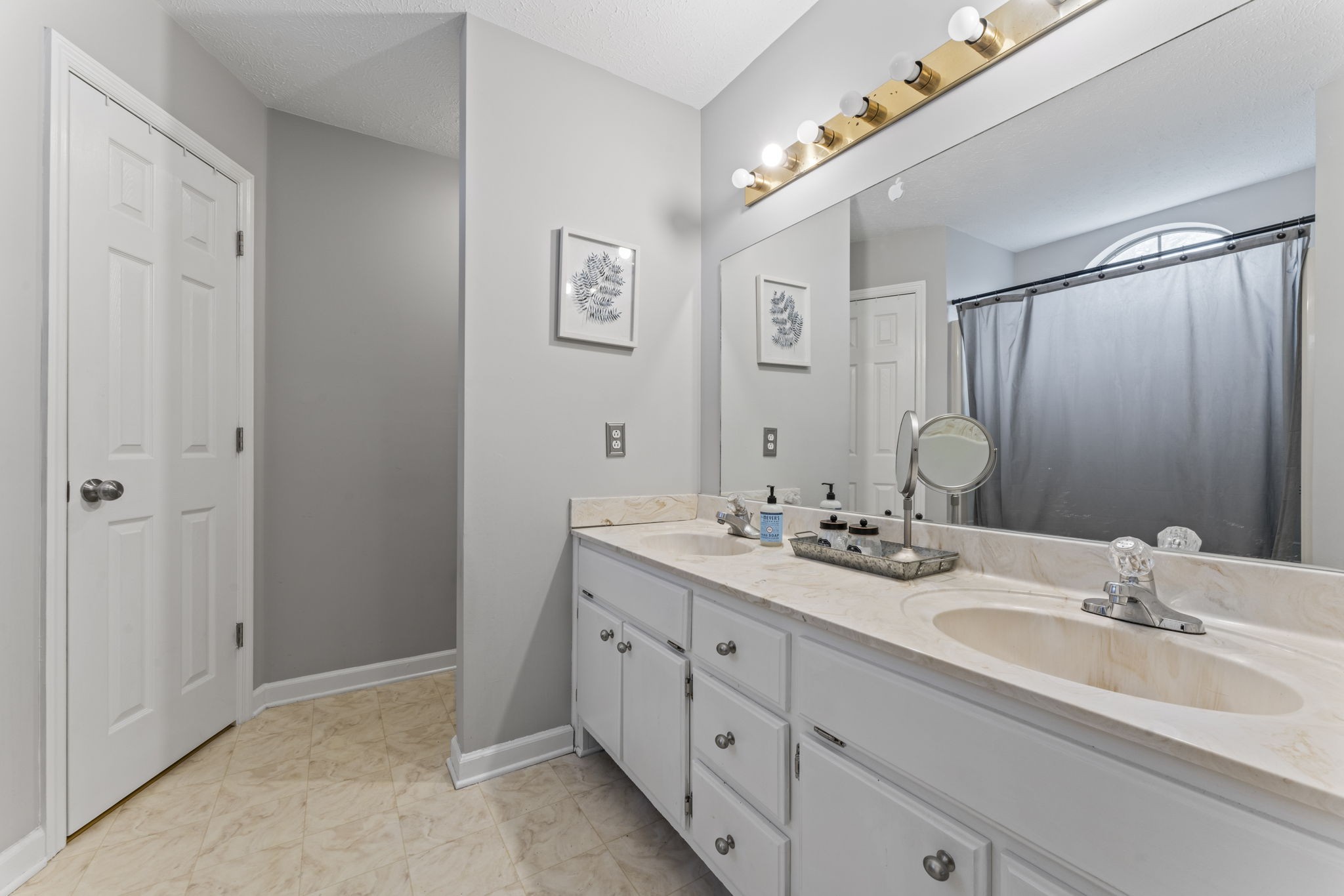 3591 April Lane Murfreesboro, TN 37130 - Photo 20 of 38 a bathroom with double sink and a mirror