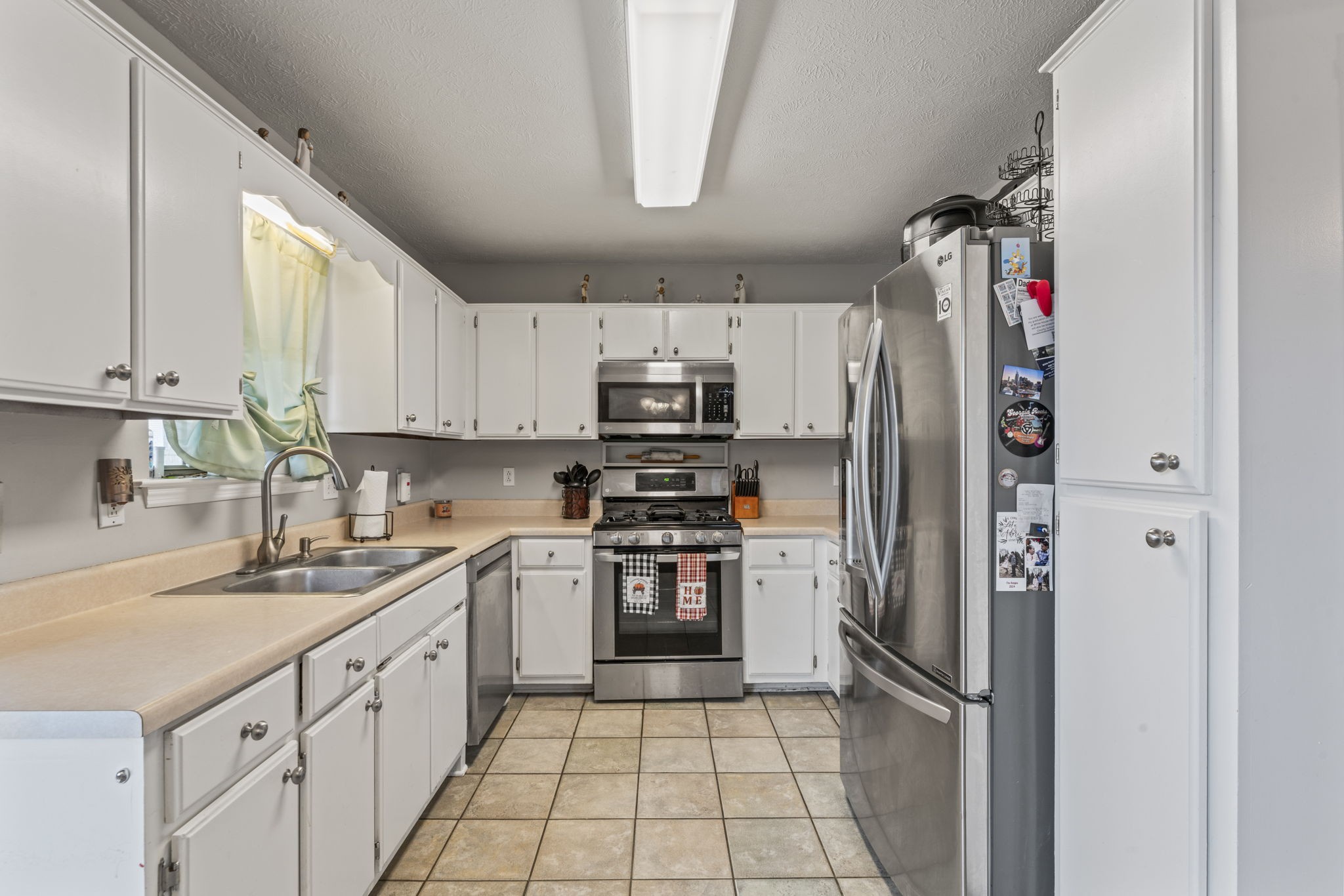 3591 April Lane Murfreesboro, TN 37130 - Photo 10 of 38 a kitchen with stainless steel appliances granite countertop a refrigerator sink and stove