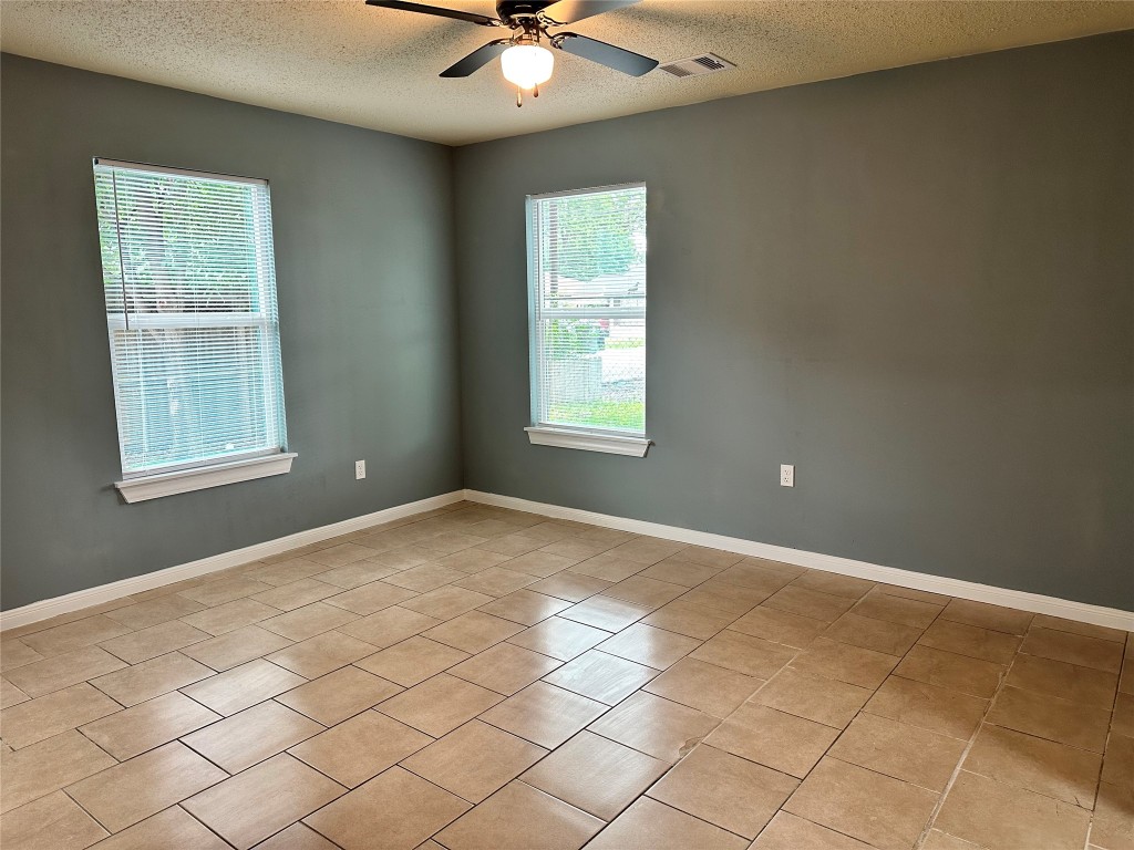 6911 Bauman Road Houston, TX 77022 - Photo 11 of 17 a view of an empty room with a window
