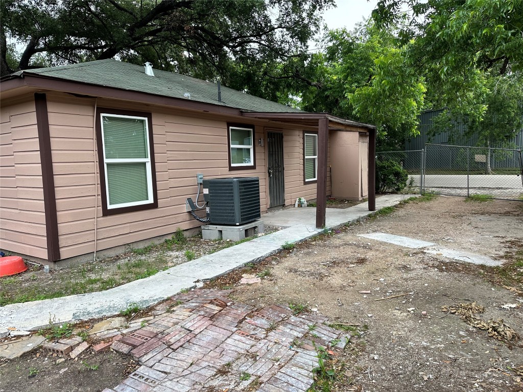 6911 Bauman Road Houston, TX 77022 - Photo 3 of 17 a backyard of a house with seating space