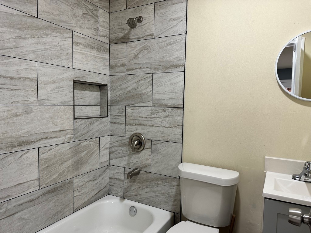 6911 Bauman Road Houston, TX 77022 - Photo 9 of 17 a bathroom with a toilet and a shower