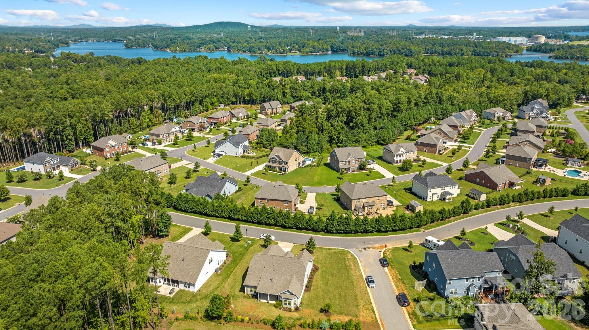 4697 Rinaldo Road York, SC 29745 - Photo 37 of 37 an aerial view of a house with a garden and lake view