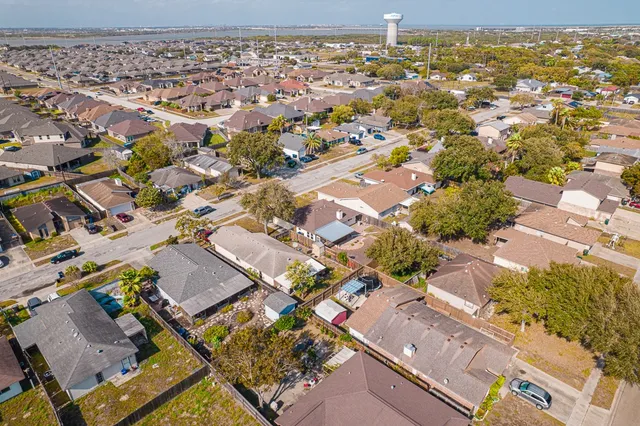 an aerial view of residential houses with outdoor space